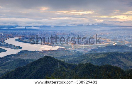 Aerial panorama of busy Taipei City with a view of Kuandu  plain, Tamsui River and downtown area with Taipei 101 at dawn ~ A blue and misty morning in Taipei, Taiwan