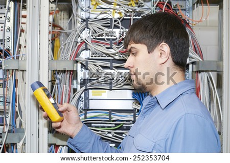 IT specialist holds in his hands network scanner