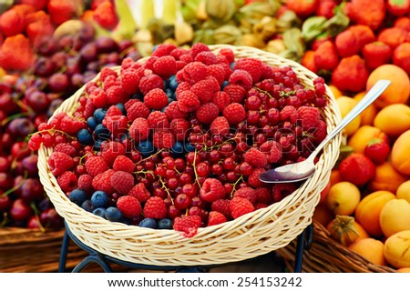 Berries mix in basket with spoon