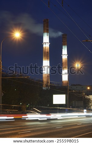 Steam of boiler room from the tubes at night in Moscow city