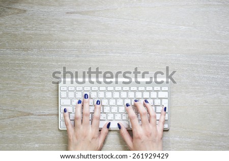 Hands printing text using keyboard