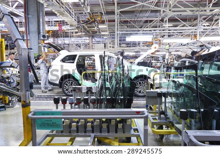 KALUZHSKY region, RUSSIA - JUNE 16: Car\'s window installation at automotive Mitsubishi (PCMA) plant on june 16, 2015