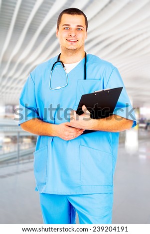 Male Doctor stands in the hall of the hospital