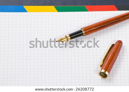ink pen on notebook