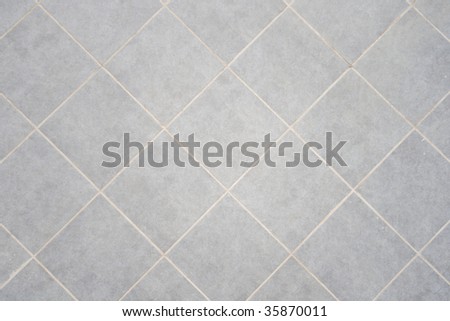 Ceramic tile background. Close-up of newly installed tile with natural colored grout.