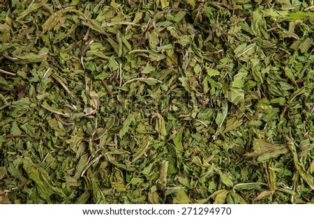 dried crushed mint leaves abstract background