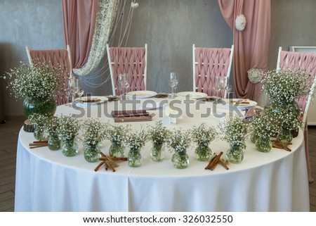 Table decor with flowers at wedding. Beautiful flowers on table in wedding day