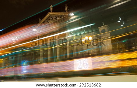 PARIS - SEPT 17, 2014: Light from the bus and night view of the south facade of the Church Notre-Dame-de-Lorette. It is a neoclassical church in the 9th arrondissement of Paris, France.