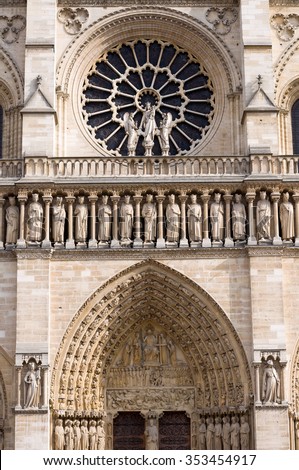 The western rose window, kings statues and architectural details of the catholic cathedral Notre-Dame de Paris. Built in French Gothic architecture, and it is among the largest and most famous church.