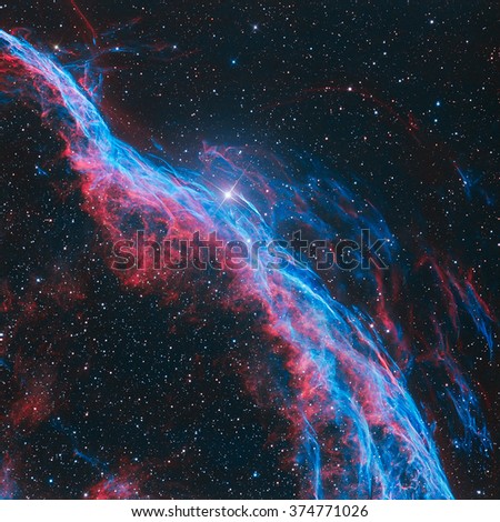 The Witch's Broom Nebula (The Veil Nebula) is a cloud of heated and ionized gas and dust in the constellation Cygnus. Retouched colored image. Elements of this image furnished by NASA.