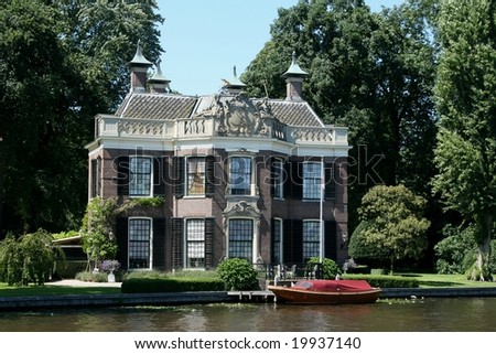 Old historical building at the river the Vecht in the Netherlands