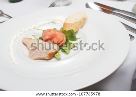 Wedding dinner - starter - smoked fish fillet from salmon and Rainbow trout with the French loaf