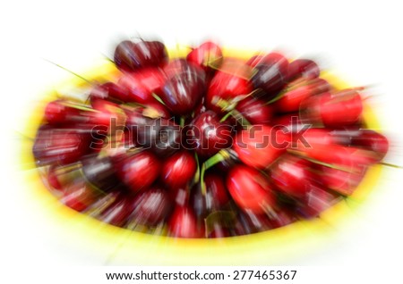 Panning of a basket of organically grown bing cherries in a local fruit market at Ellensburg, Washington, US