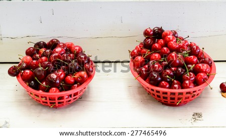 A row basket of organically grown bing cherries in a local fruit market at Ellensburg, Washington, US