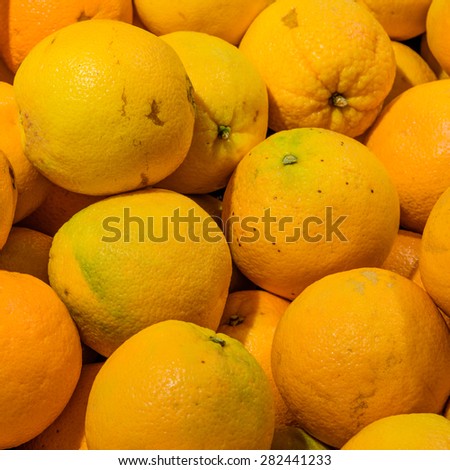 Group of fresh navel oranges in a supermarket at Colfax, Whitman County, Washington, USA. Close up and full frame view of navel oranges. Color full and healthy concept.