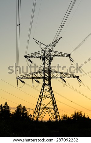 Pylon high voltage power lines silhouette in sunset at Fairwood, King County, Washington State, USA