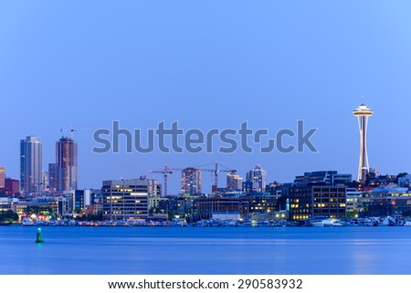 Seattle Skylines with light reflection on Lake Union in blue hour. The view from Gas Works Park Ã¢Â?Â? a tourists attraction and popular local place.