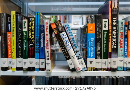 WASHINGTON, USA - JUNE 27 - A bookshelf of African travel books in King County Library System (KCLS). This is library system serving the residents of King County, Washington, United States.