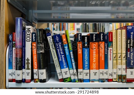 WASHINGTON, USA - JUNE 27 - A bookshelf of South American travel books in King County Library System (KCLS). This is library system serving the residents of King County, Washington, United States.