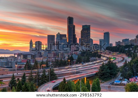 This is an epic sunset over Seattle skylines/downtown in summertime. The view is from Rizal Bridge, a prominent viewpoint for gorgeous sunset in Seattle. Cityscape, busy, rush hour, high speed concept