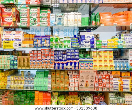 SINGAPORE OCT 25, 2015: Various Pills and Drugs for Sale Display on Shelves in a Pharmacy of Singapore