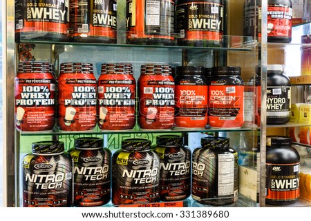 SINGAPORE OCT 25, 2015: Workout supplement, sport nutrition, bodybuilding supplements, sport diet power, whey, and soy and egg protein, chemistry on display on shelves in a Pharmacy