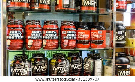 SINGAPORE OCT 25, 2015: Workout supplement, sport nutrition, bodybuilding supplements, sport diet power, whey, and soy and egg protein, chemistry on display on shelves in a Pharmacy