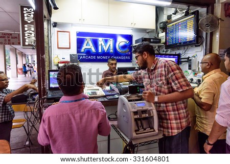 SINGAPORE - OCT 20, 2015: Arcade money changer shop at Arcade building near Raffles Place. The Arcade money changer is serving customers with foreign exchange over three decades