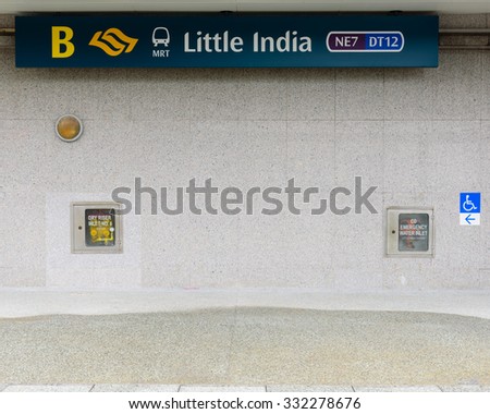 SINGAPORE â?? OCT 26, 2015: Sign of MRT Station at Little India. The Mass Rapid Transit is a rapid transit system forming the major component of railway system spanning the entire city-wide Singapore
