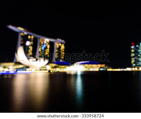 City night lights bokeh of Singapore blurred background. Colourful urban skylines concept