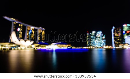 City night lights bokeh of Singapore blurred background. Colourful urban skylines concept. Panoramic style