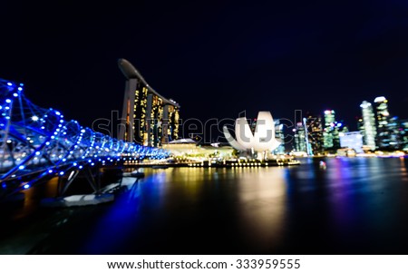 City night lights bokeh of Singapore blurred background. Colourful urban skylines concept. Panoramic style