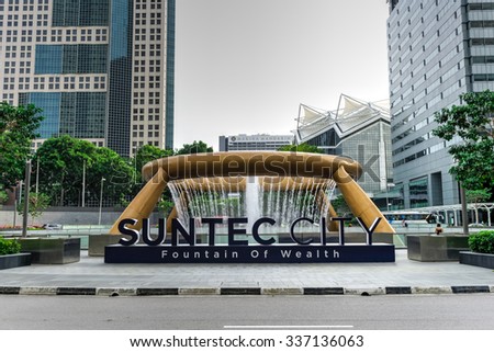 SINGAPORE â?? NOV 7, 2015: Front view of Fountain of Wealth at Suntect City - the largest fountain in the world, like a golden ring in the palm of hand, designs by Tsao & McKown, emphasis on feng shui