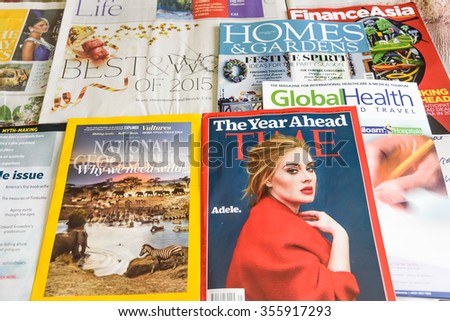 SINGAPORE-DEC 27, 2015: Close-up view of Newspapers and Financial and Lifestyle magazines, they are complementary on the international flights of Singapore Airlines, the flag carrier of Singapore