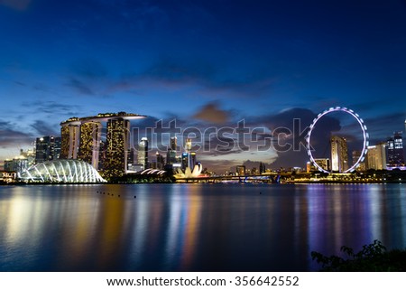 Singapore Skylines, Downtown and Financial District buildings reflection along the Singapore River at Blue Hour. Modern City Background. Urban night view.
