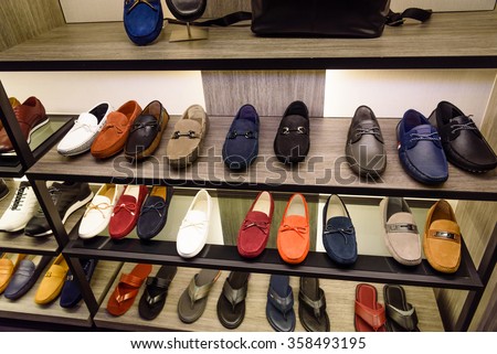 Variety colorful slip-ons or drivers shoes and sandals on the shelf in the menâ??s fashion footwear and accessories shop in Singapore. Casual, fashion and work shoes for men.