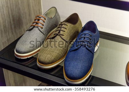 Variety colorful leather casual derby shoes on the shelf in the menâ??s fashion footwear and accessories shop in Singapore. Casual, fashion and work shoes for men.