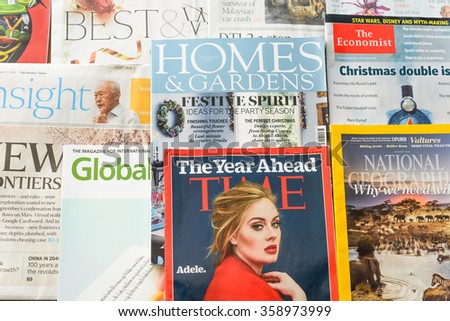 SINGAPORE-JAN 5, 2015: Close-up view stack of variety Newspapers, Financial and Lifestyle magazines, they are complementary on the international flight of Singapore Airlines, flag carrier of Singapore