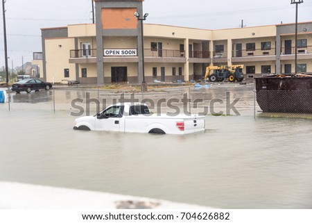 Pickup truck swamped by flood water in Humble, Texas,US by Harvey Tropical Storm. Flooded car under deep on heavy high water road. Disaster Motor Vehicle Insurance Claim Themed. Severe weather concept