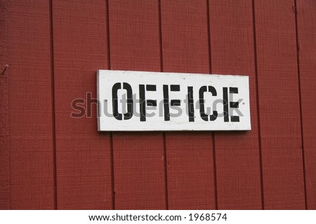 An office sign on a building.