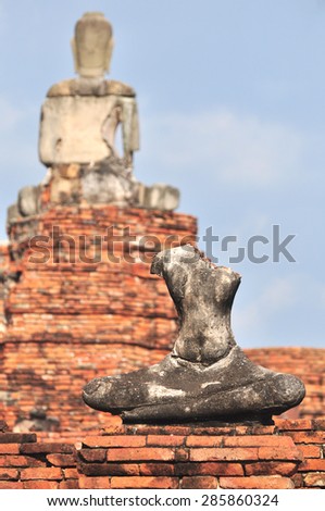 Ancient Buddha back statue and old ruins of old capital city of Thailand can be found at Mahathat Temple or Ayutthaya Historical Park.