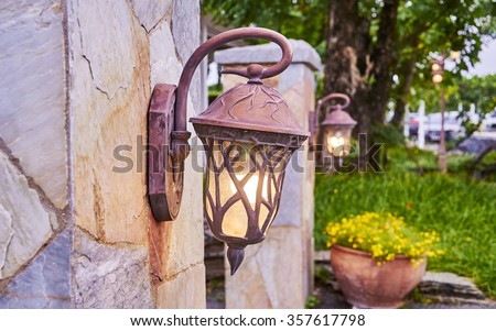 Vintage bronze classic Lamp in front of the park.