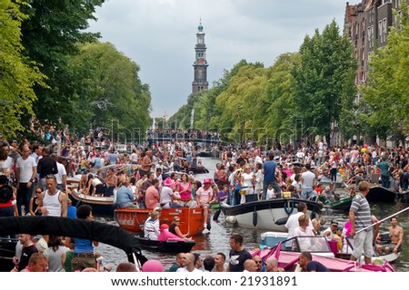 AMSTERDAM - AUGUST 2: A large crowd gather at the Amsterdam canals to watch \'Gay Pride 2008\', an event held on august 2th, 2008, in Amsterdam, Netherlands