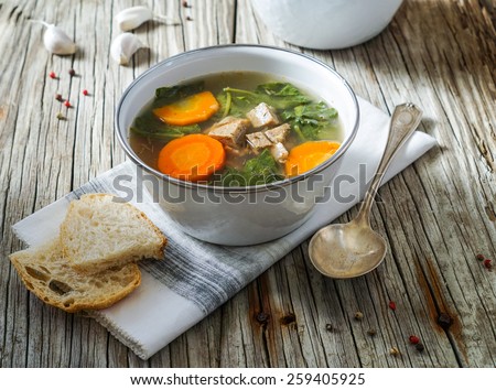 Italian Wedding Soup with Meatballs on Rustic Wood Background