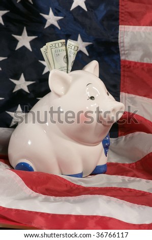 vertical image of piggy bank on an american flag