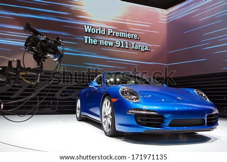 Detroit - January 13 :A Video Camera Captures Video Footage Of The New Porsche 911 Targa On Display At The North American International Auto Show Media Preview January 13, 2014 In Detroit, Michigan.
