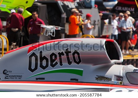 DETROIT - JULY 11:A small unmanned drone camera inspects the Oberto hydroplane at the APBA Gold Cup July 11, 2014 on the Detroit River in Detroit, Michigan.