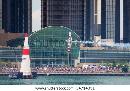 WINDSOR, ONT JUNE 5 - Spectators watch World Champion Paul Bonhomme speed by at the Red Bull Air Races June 5, 2010 on the Detroit River in Windsor, Ontario