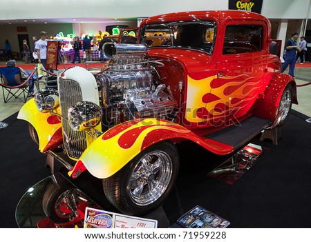 DETROIT - FEB 25: A classic hot rod with flame paint job at the Autorama Show February 25th, 2011 in Detroit, Michigan.
