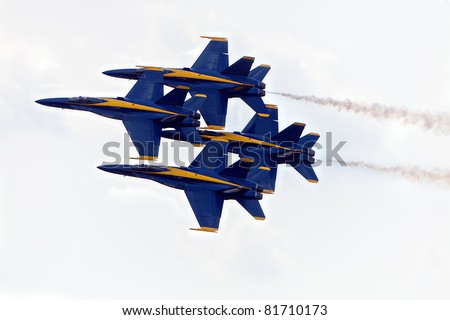 YPSILANTI, MI - JULY 24 : The US Navy Blue Angels execute the diamond formation at the Thunder Over Michigan air show on July 24th, 2011 in Ypsilanti, Michigan.